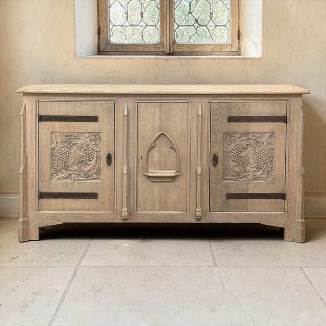 A handsome Gothic Revival buffet in stripped oak, with the clean architectural lines and carved detail that make this...