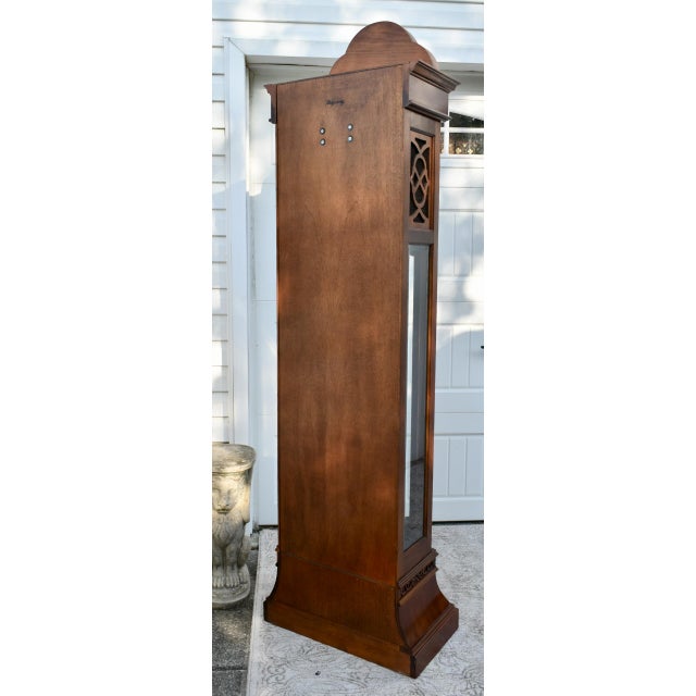 Vintage (1980's) GrandFathers Clock has a Chinese Chippendale Style. Made by Ridgeway. The Wood is Mahogany. Features of...