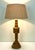 This large Mid-Century table Lamp is full of rustic sophistication, crafted of oak wood and featuring warm neutral hues...