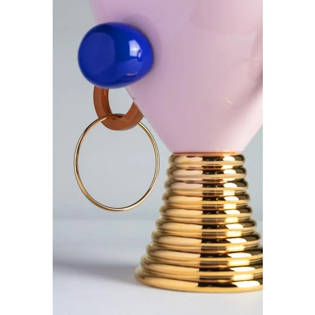 A large ceramic container inspired by the unmistakable aesthetics of tribal cultures. The charm for primitive language is...