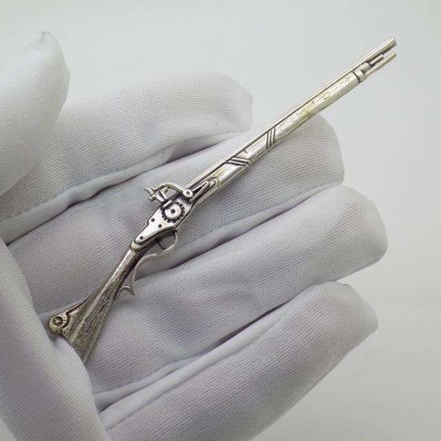 This vintage silver miniature depicts a long rifle (fucile). Handcrafted in arezzo, tuscany during the 1970s to 1980s by...
