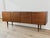 Elegant teak sideboard with a clean and perfectly balanced design dating from the 1970s. Its minimalist aesthetic is...