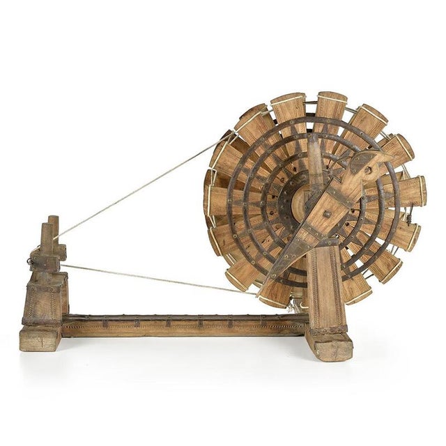 A testament to ancestral artisanal know-how, this solid wood Indian spinning loom fascinates as much by its ingenious...