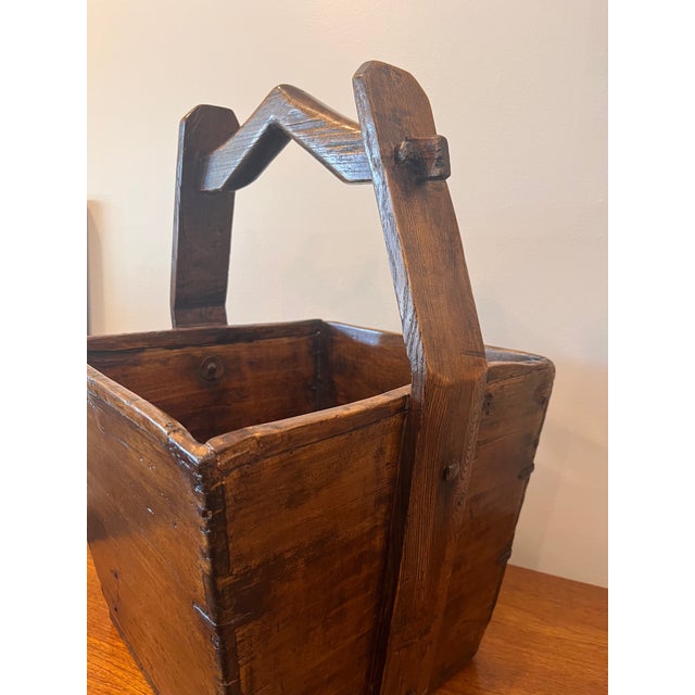 A beautiful and rustic Chinese Grain Basket dating to the 19th century. The basket has a simple form and linear details, a...