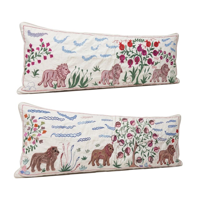 This beautiful 18'' x 54'' hand-embroidered Suzani pillow cover set was made from authentic Uzbek cotton fabric. The...