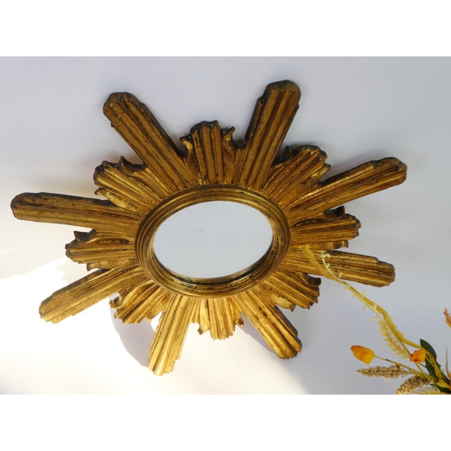 Mid century gold gilded sunburst mirror made in Italy. It is made out of good quality and is original. An eye catching...