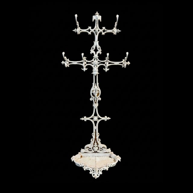 Amazing antique Victorian cast iron hall tree with removable base dish. Heavy and sturdy! 33 x 76 x 13 inches.