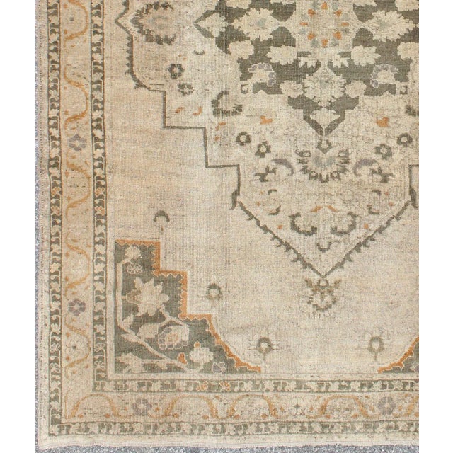 Tribal Vintage Turkish Oushak Rug With Floral Medallion Design in Light Tones For Sale - Image 3 of 9