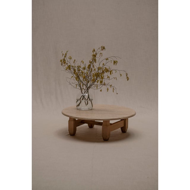 A sculptural and tactile Brutalist coffee table from the 1960s, combining solid travertine with a natural oak base. The...