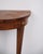 Antique console table made in fruitwood with marquetry from around the 1880s. The table features tapered legs and...