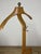 Wooden valet stand with anthropomorphic brass details, designed and produced by Fratelli Reguitti in the 1960s. The valet...