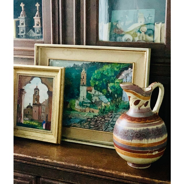 One-of-a-kind vintage, handmade Mexican folk art style painted pottery water pitcher. Beautiful iconic designs and rustic...