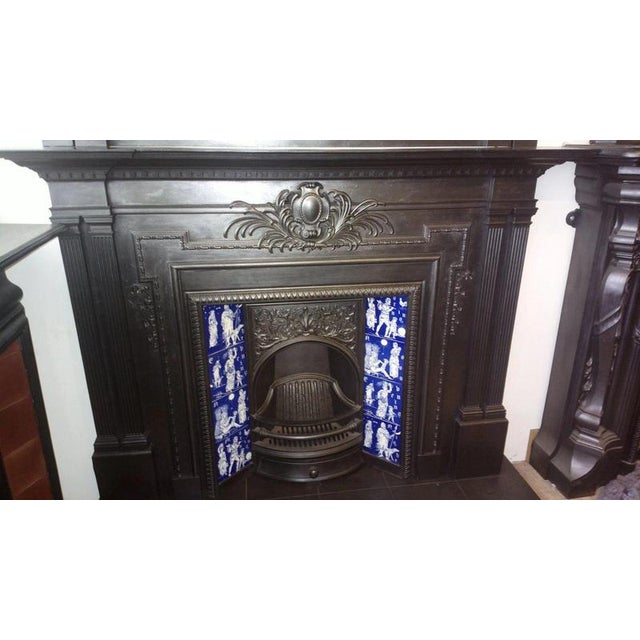 An impressive original victorian cast iron fireplace surround with matching overmantel mirror, manufactured by the...