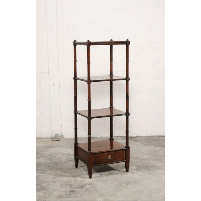 This elegant English étagère is crafted in rich mahogany, showcasing a refined balance of utility and classic form. The...