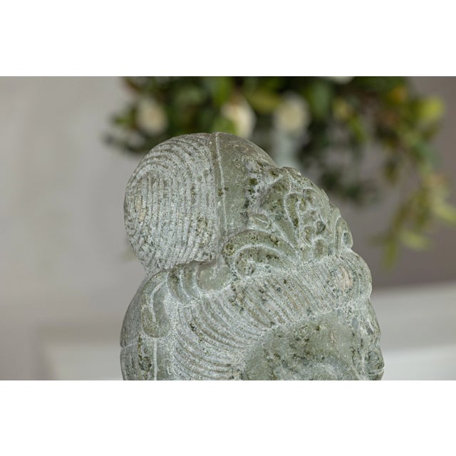 This vintage stone Quán Yīn head sculpture, hand-carved in mid-20th-century China, captures the Bodhisattva of Compassion...