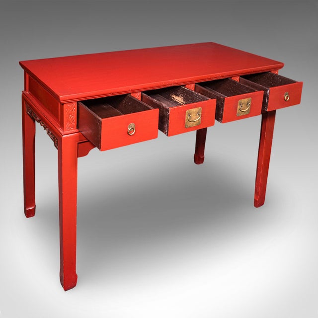 This is a tall vintage hall table. An Oriental, red lacquer Art Deco revival side or reception table, dating to the late...