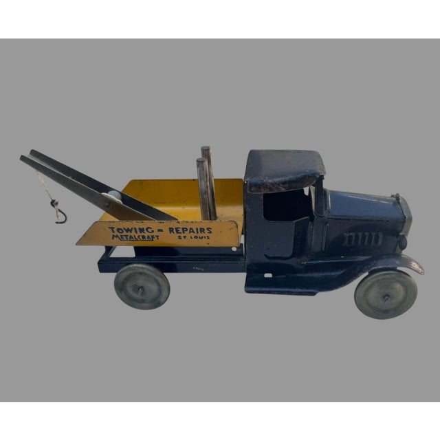 Wonderful original antique Metalcraft Corporation pressed-steel Towing & Repairs wrecker truck, made in St. Louis,...