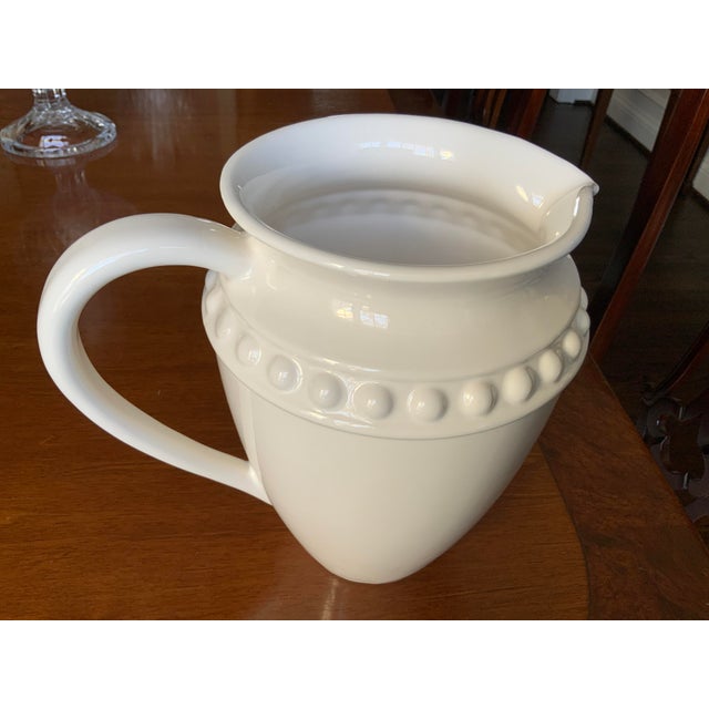 White Ceramic Pitcher With Beaded Design & Curved Handle From Portugal Pretty as a pitcher (drum roll). Love this...