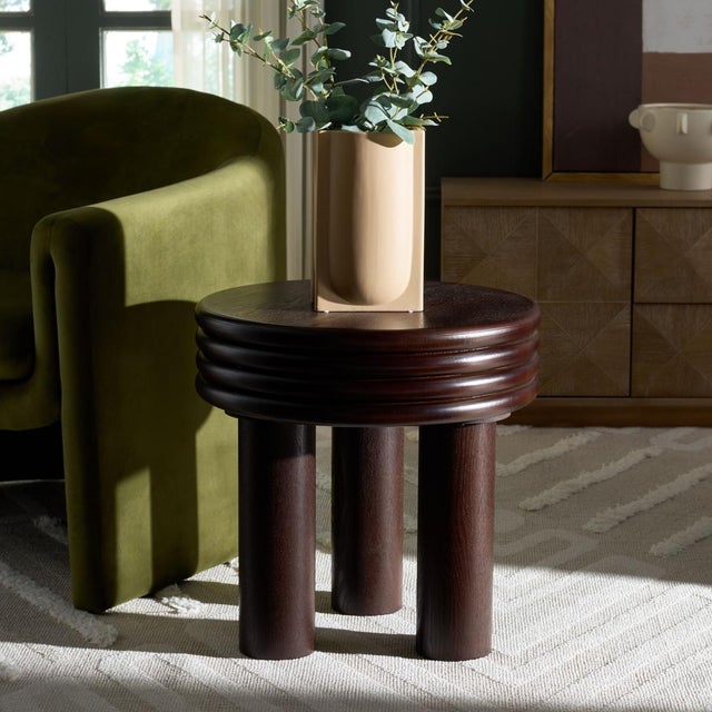 Presenting our Ohana Accent Table! This standout interior decor piece is a dark brown stunner, a must-have addition to any...