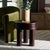 Presenting our Ohana Accent Table! This standout interior decor piece is a dark brown stunner, a must-have addition to any...