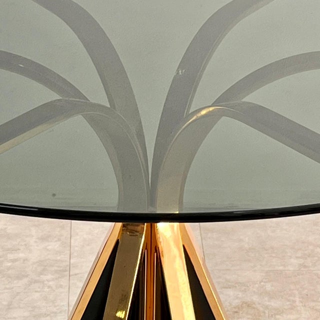 Rare and dramatic circular dining table designed by Italian designer Renato Zevi in ​​the 1960s and 1970s. The table's...