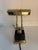 This Piano/Desk Lamp from House of Troy has a polished brass finish. Base is a heavy black marble style cube. Uses a...