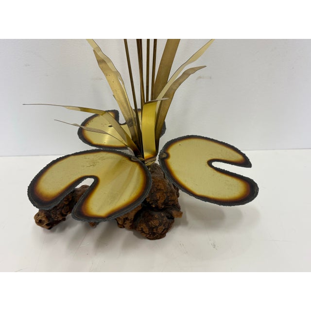 Here we have a beautiful Vintage brass and wood Cattails with Dragonfly Sculpture Lilypad With Driftwood Base from the...