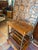 The Antique English Walnut Magazine Rack (Canterbury) is a beautifully crafted handmade piece made of wood, featuring a...