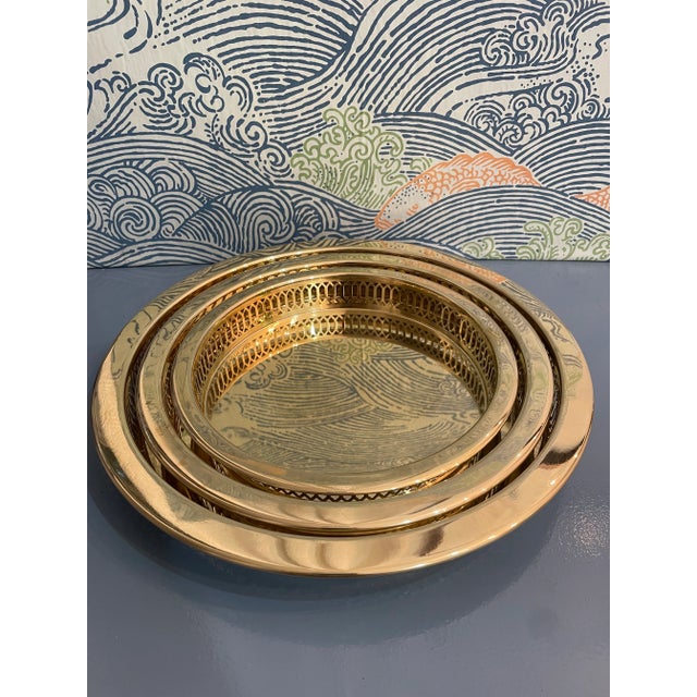 Brass gallery trays are the perfect accessory… but a set of 3! These gleaming trays with pierced sides can be displayed...