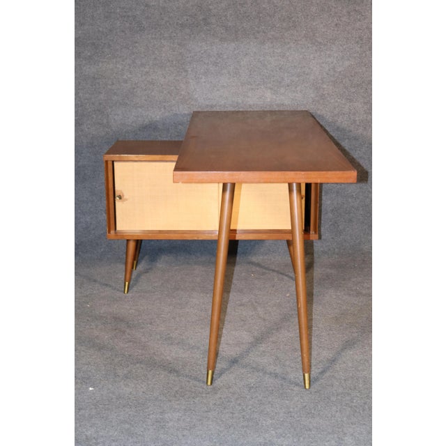 Unusual office desk with storage cabinet space. Paul McCobb style maple wood, cone legs and grass cloth cabinet.