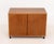Danish Modern Teak Cabinet, with two doors opening to two shelves atop casters. 23" H x 31.5" W x 18.25" D. Provenance:...