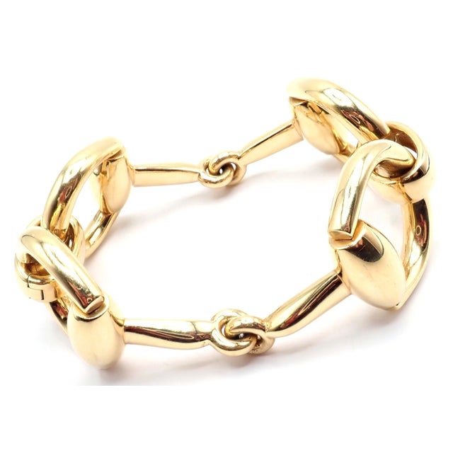 Gucci equestrian bracelet crafted in luxurious 18k yellow gold, featuring oversized horsebit links inspired by classic...
