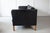 A beautiful Danish black leather sofa, designed in the style of Borge Mogensen. The leather is in very good vintage...