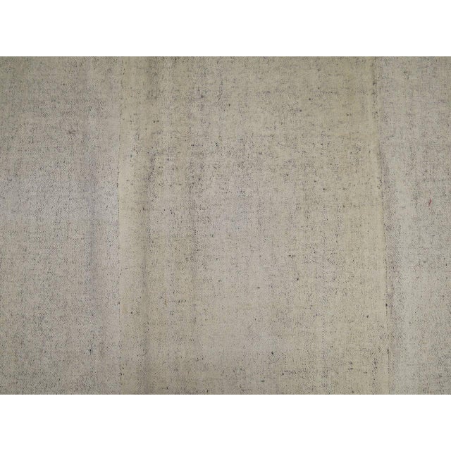 Plain solid field square-shaped mid-20th century Kilim with linen backing. 8'7'' x 8'9''
