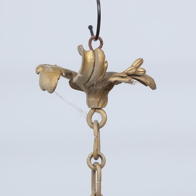 A 20th century chandelier with serious weight to it — substantial cast bronze, not the hollow stuff. Came from a Swedish...
