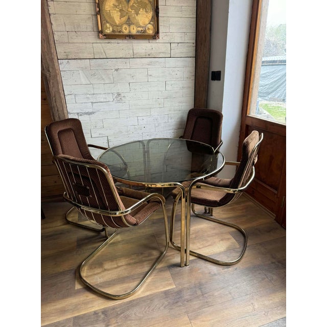 This stunning Gastone Rinaldi copper dining set features four elegant chairs and a matching table, showcasing iconic mid-...