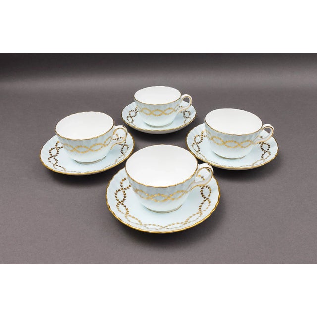 Minton England S600 Intertwined Gold Laurel Leaves Light Blue Swirl Tea Cup & Saucer Set Of 4. Three of the four cups and...