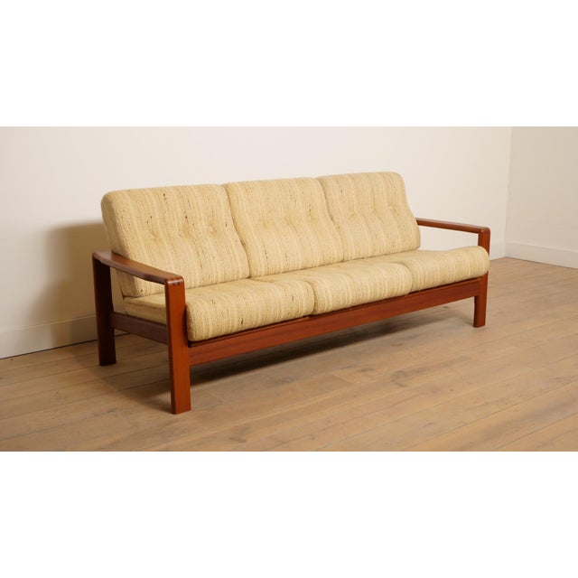 Beautiful vintage teak 3-seater sofa, designed in the 1960s, in distinctive Danish style. This stylish sofa is incredibly...