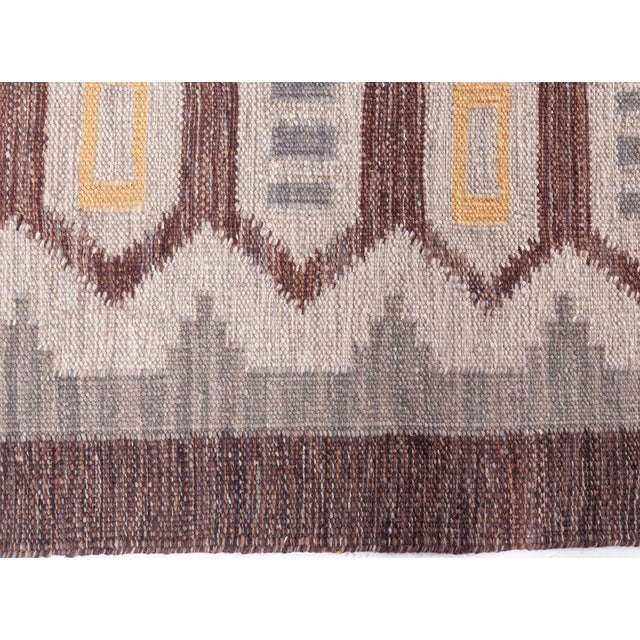 This striking modern Swedish flat weave rug showcases the timeless appeal of Scandinavian design, blending clean geometry...