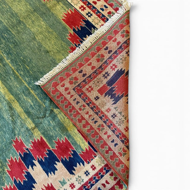 This striking vintage Turkish rug from the 1980s features a beautiful balance of traditional Anatolian design and modern...