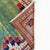This striking vintage Turkish rug from the 1980s features a beautiful balance of traditional Anatolian design and modern...