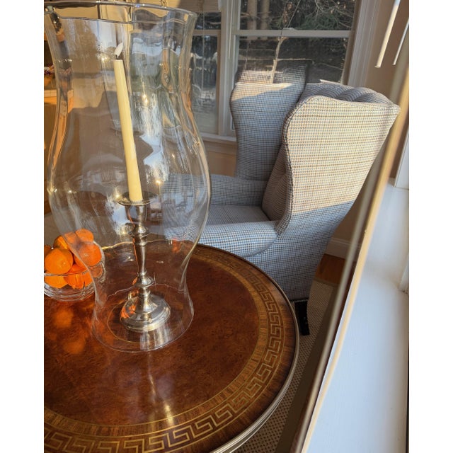 Pair of Neoclassical Greek Key Inlaid Pedestal Side Tables with Custom Glass Tops A rigorously composed pair of...