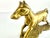 A sculptural mid-century brass horse frozen in mid-stride, this vintage figurine captures the energy of movement with...