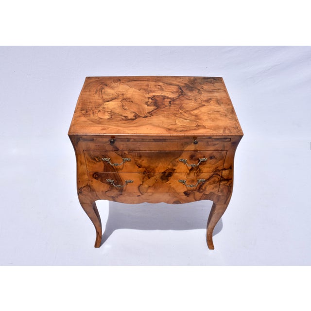 An Italian Mid-Century bomb'e chest or side / end table with Oyster Burl veneer, pull out shelf and two drawers, original...