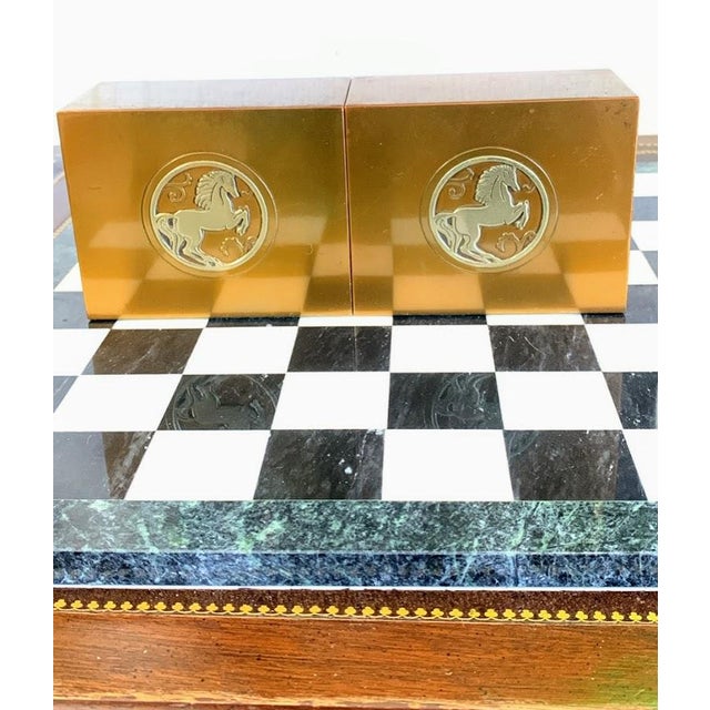 Elegant vintage Silver Crest brass bookends featuring a raised rearing horse medallion design. Crafted from solid, heavy-...