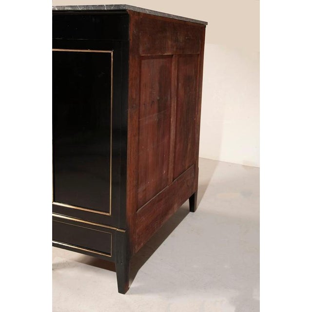 Late 19th-century french napoleon iii weekly chest, restored with a black ebonized wood finish. The piece is topped with a...