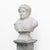 A refined Carrara marble bust depicting a young Roman emperor, crafted with meticulous attention to detail and inspired by...