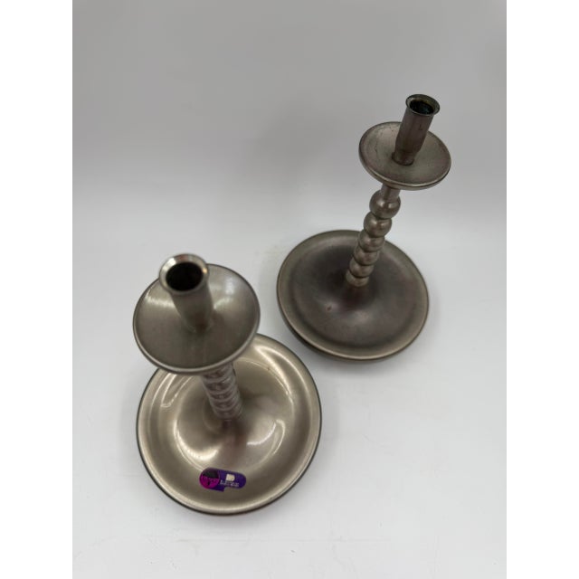 A superb and rare matching pair of vintage brushed chrome bobbin-stem candlestick holders, offered as a set of two. ✦...