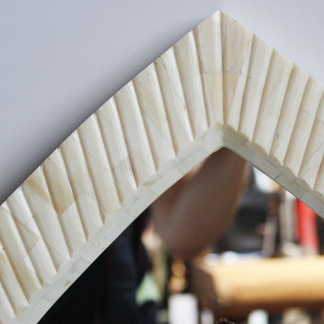 Vintage hand carved mirror frame with lovely cream tones and Moorish shaped arch design. Gorgeous wall mirror that is...