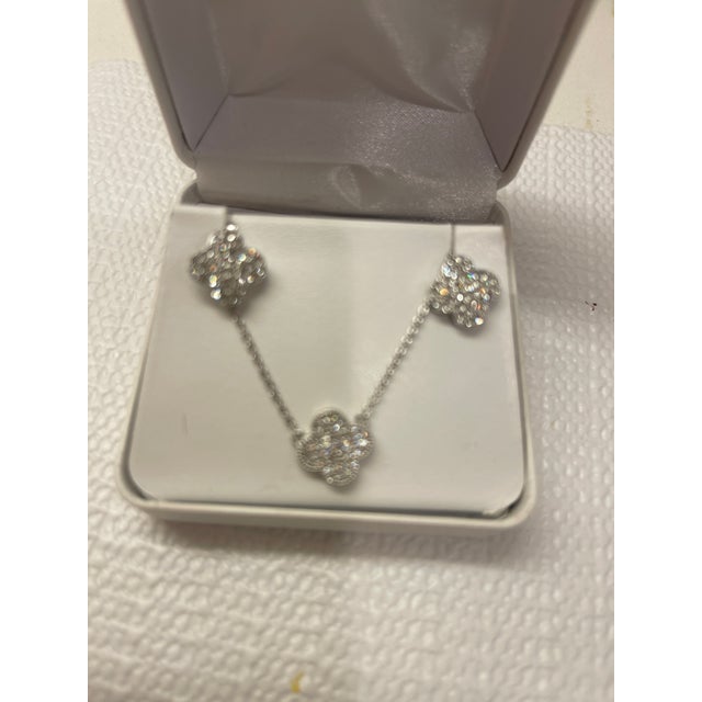 famous shape 3 piece set with pierced earings and 16" long pendant done in top quality CZs and sterling